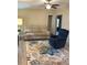 Inviting living room with wood-look flooring and a floral area rug creating a cozy atmosphere at 36822 Kay Ave, Zephyrhills, FL 33542