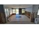 Renovation in progress, showing a large open area with new tile floors and exposed framing at 4310 Huntington Ne St, St Petersburg, FL 33703