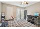 Bedroom featuring wood-look floors, a ceiling fan, and sliding doors offering natural light at 455 Alt 19 S # 151, Palm Harbor, FL 34683