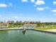 Scenic aerial view showcasing the waterfront condos, pool, pier, and beautiful coastal setting at 5200 Brittany S Dr # 1202, St Petersburg, FL 33715