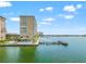 Expansive aerial view of waterfront condos with pool, boat docks, and the serene bay setting at 5200 Brittany S Dr # 1202, St Petersburg, FL 33715