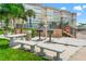 Outdoor grilling area featuring BBQ grills, benches, and tables for residents to enjoy at 5200 Brittany S Dr # 1202, St Petersburg, FL 33715