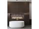 Spa-like bathroom with a freestanding tub and fireplace at 1076 Snell Isle Ne Blvd, St Petersburg, FL 33704