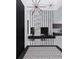 Elegant entryway with marble accent wall and geometric tile floor at 1076 Snell Isle Ne Blvd, St Petersburg, FL 33704