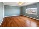 Bright bedroom with hardwood floors and a large window at 5200 Brittany S Dr # 1202, St Petersburg, FL 33715