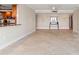Open concept living room and kitchen with tile floors at 5200 Brittany S Dr # 1202, St Petersburg, FL 33715