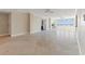 Open living room with hardwood floors and access to other rooms at 5200 Brittany S Dr # 1202, St Petersburg, FL 33715