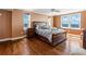 Comfortable bedroom with hardwood floors and large windows at 5200 Brittany S Dr # 1202, St Petersburg, FL 33715