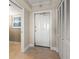 Bright condo entryway with white door and built-in storage at 5200 Brittany S Dr # 1202, St Petersburg, FL 33715