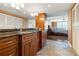 Elegant bathroom with granite countertops and a large vanity at 5200 Brittany S Dr # 1202, St Petersburg, FL 33715