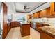 Gourmet kitchen boasting granite counters, island, and stainless steel appliances at 5200 Brittany S Dr # 1202, St Petersburg, FL 33715