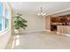 Bright dining room with tile floors and chandelier, adjacent to kitchen at 5200 Brittany S Dr # 1202, St Petersburg, FL 33715