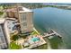Aerial view showing the community pool, dock, and waterfront location at 5200 Brittany S Dr # 1202, St Petersburg, FL 33715