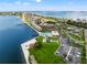 Aerial view showcasing waterfront property, pool, and grounds at 5200 Brittany S Dr # 1202, St Petersburg, FL 33715