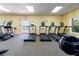 Well-equipped fitness center featuring treadmills, elliptical machines, and weight training equipment at 5200 Brittany S Dr # 1202, St Petersburg, FL 33715