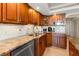 Well-equipped kitchen featuring granite countertops and ample cabinetry at 5200 Brittany S Dr # 1202, St Petersburg, FL 33715