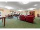 Community room with seating area and multiple tables at 5200 Brittany S Dr # 1202, St Petersburg, FL 33715