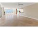 Spacious living room with tile floors and large windows offering water views at 5200 Brittany S Dr # 1202, St Petersburg, FL 33715