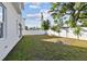 Spacious backyard with a grassy lawn and a white fence at 3119 W Cypress St, Tampa, FL 33607