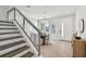 Bright entryway with modern staircase, tile flooring, and dining area at 3119 W Cypress St, Tampa, FL 33607
