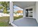 Covered patio with sliding door access to backyard at 3119 W Cypress St, Tampa, FL 33607