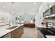 Modern kitchen with island, stainless steel appliances, and white cabinetry at 3119 W Cypress St, Tampa, FL 33607
