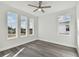 Well-lit bedroom with hardwood floors and multiple windows at 3119 W Cypress St, Tampa, FL 33607