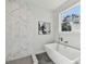 Modern bathroom with a soaking tub and marble shower at 3119 W Cypress St, Tampa, FL 33607