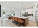Modern kitchen with white cabinets, large island, and stainless steel appliances at 3119 W Cypress St, Tampa, FL 33607