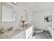 Spa-like bathroom with marble shower, soaking tub, and double vanity at 3119 W Cypress St, Tampa, FL 33607