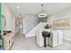 Modern entryway with stylish console table and view to hallway at 3119 W Cypress St, Tampa, FL 33607