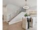 Bright dining area with modern table and chairs, and staircase at 3119 W Cypress St, Tampa, FL 33607