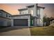 Modern two-story house with green door and gray exterior at 3119 W Cypress St, Tampa, FL 33607