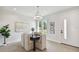 Modern dining area with a dark wood table and six chairs at 3119 W Cypress St, Tampa, FL 33607