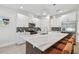 Modern kitchen with island, stainless steel appliances, and white cabinetry at 3119 W Cypress St, Tampa, FL 33607