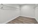 Bright walk-in closet with wire shelving and hardwood floors at 3119 W Cypress St, Tampa, FL 33607
