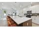 Modern kitchen with island, stainless steel appliances, and white cabinetry at 3119 W Cypress St, Tampa, FL 33607