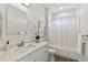 Bathroom with white vanity, shower/tub combo, and modern decor at 3119 W Cypress St, Tampa, FL 33607