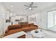 Bright living room with sectional sofa and view to the kitchen at 3119 W Cypress St, Tampa, FL 33607