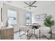 Home office with wood desk, two chairs, and ceiling fan at 3119 W Cypress St, Tampa, FL 33607