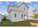 Newly built home with a fenced backyard and grassy lawn at 3119 W Cypress St, Tampa, FL 33607