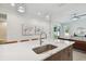Modern kitchen island with marble countertop and stainless steel sink at 3119 W Cypress St, Tampa, FL 33607
