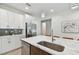 Modern kitchen with stainless steel appliances and white cabinetry at 3119 W Cypress St, Tampa, FL 33607