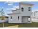 Modern home exterior with unique architectural design and backyard at 3119 W Cypress St, Tampa, FL 33607