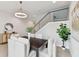 Modern dining area with dark wood table and light beige chairs at 3119 W Cypress St, Tampa, FL 33607