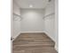 Large walk-in closet with wire shelving and hardwood floors at 3119 W Cypress St, Tampa, FL 33607