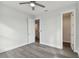 Bedroom with hardwood floors and access to bathroom and closet at 3119 W Cypress St, Tampa, FL 33607