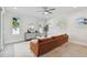 Spacious living room with large sectional sofa and access to backyard at 3119 W Cypress St, Tampa, FL 33607