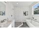 Elegant bathroom with marble shower, freestanding tub, and vanity at 3119 W Cypress St, Tampa, FL 33607