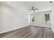 Spacious bedroom featuring hardwood floors and a ceiling fan at 3119 W Cypress St, Tampa, FL 33607